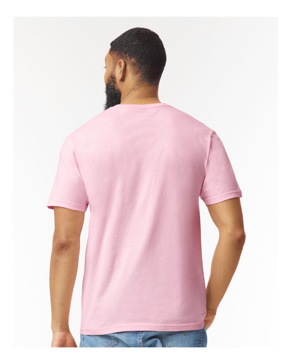Men / Unisex Colour Shirt Softstyle 100% Cotton Tee in pink, modeled from the back with short sleeves.
