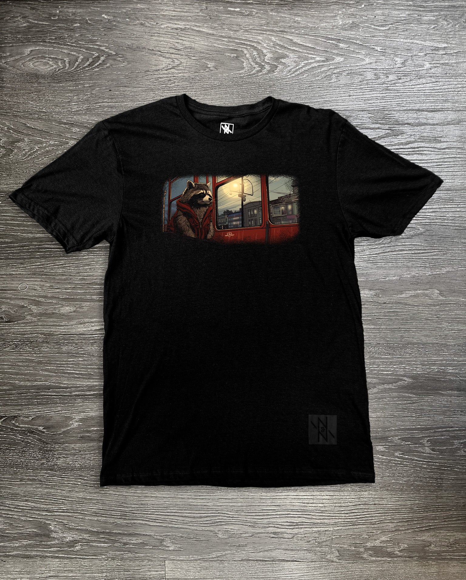 Front view of the Noir et Noir Commuter Coon T-shirt, showcasing its minimalist black design with a comfortable fit. Perfect for both casual and semi-formal occasions. Available now in the Toronto Collection.