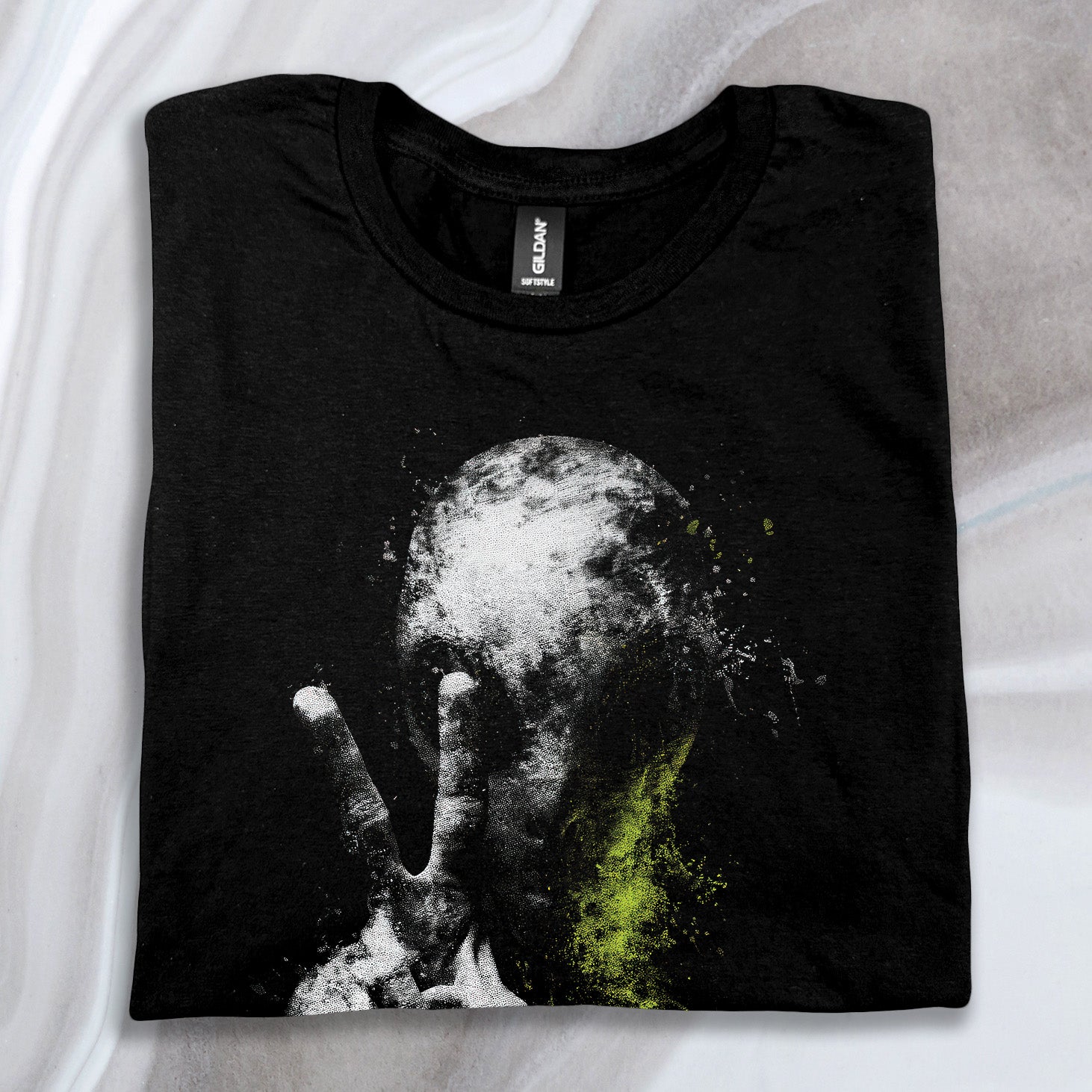 Folded black Alien Peace Sign T-Shirt featuring a grey alien with a green peace sign graphic on the front.