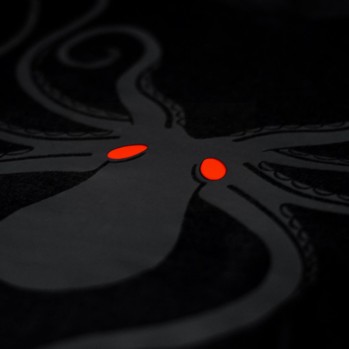 Another close-up of the Noir et Noir Octopus unisex T-shirt, focusing on the detailed black-on-black octopus design. Showcasing the artistic and high-quality print. Part of the Design Collection.