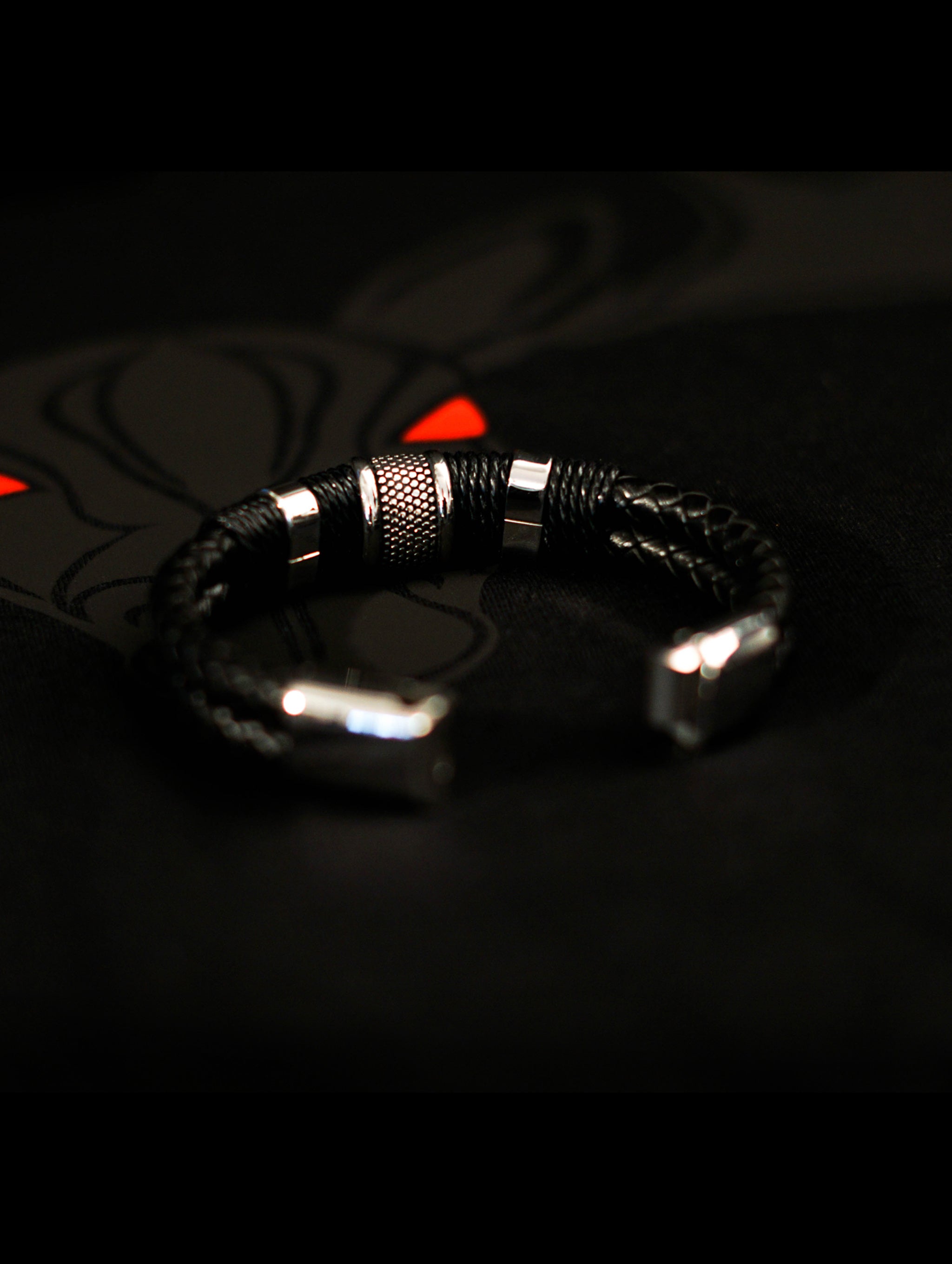 Black Woven Leather Bracelet with braided leather, stainless steel beads, twine accents, and magnetic lobster clasp closure.