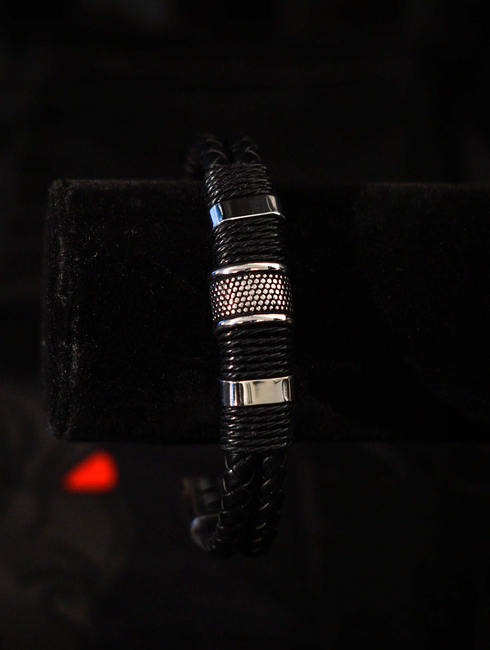 Black Woven Leather Bracelet with woven leather rows, twine, stainless steel beads, and magnetic clasp closure.