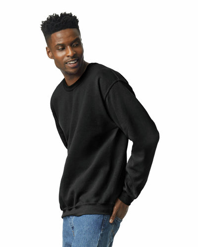 Man wearing a black Crewneck Sweatshirt | Heavy Blend with a classic fit and comfortable cotton-polyester blend.
