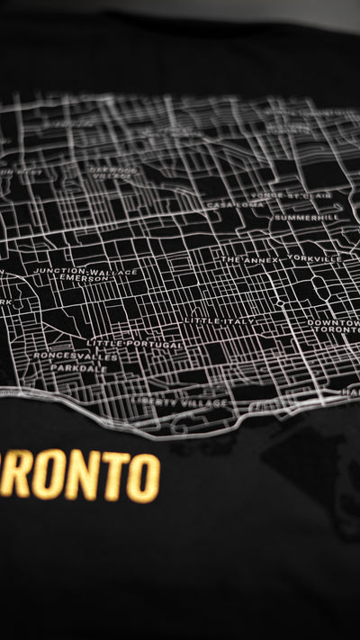 Close-up 1 of the Noir et Noir Downtown Toronto Minimalist Map T-shirt fabric, showcasing the high-quality, soft material. A key feature of the sophisticated Toronto Collection, ensuring both style and comfort
