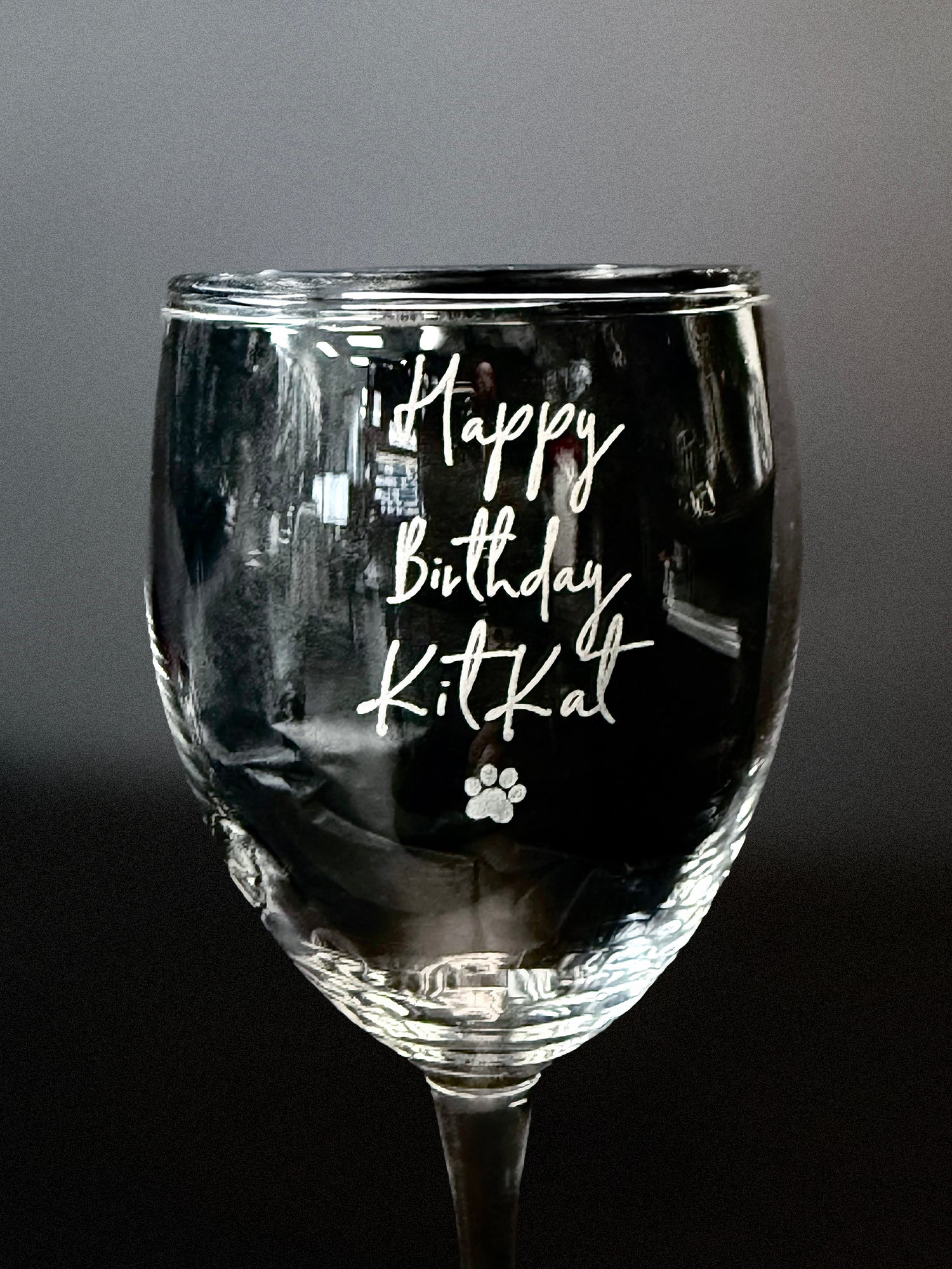 Custom Engraved Wine Glass – 11oz Tulip Design with Happy Birthday KitKat engraving and paw print detail.