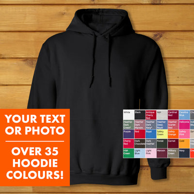 Hooded Sweatshirt | Heavy Blend black unisex hoodie with double-lined hood and pouch pocket on wooden background.