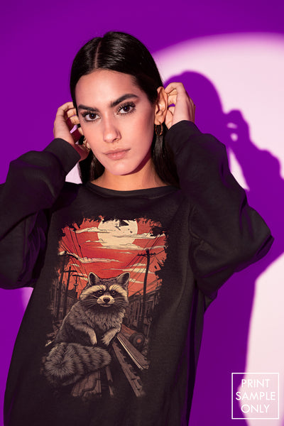 Crewneck Sweatshirt | Heavy Blend featuring a raccoon graphic on black fabric worn by a model against purple background