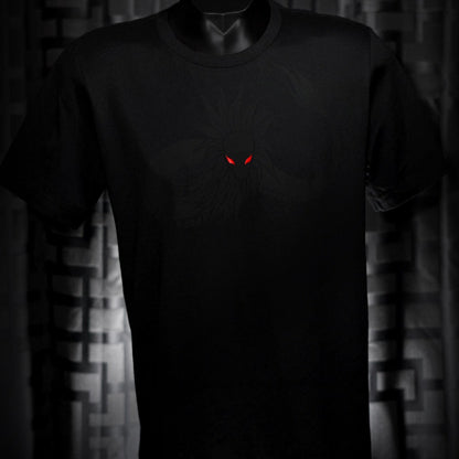 Noir et Noir Feathered Snake unisex T-shirt displayed against a dark background, emphasizing the detailed black-on-black feathered snake design and the shirt's elegant fit. Capturing the essence of the Design Collection