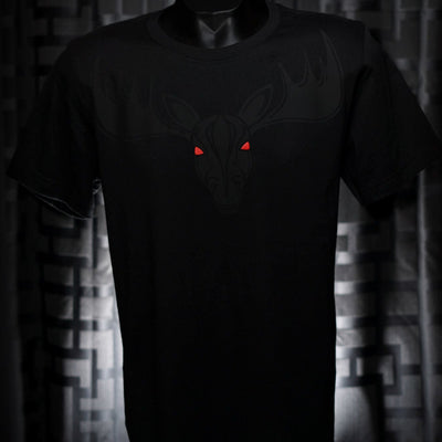 Noir et Noir Moose unisex T-shirt displayed against a dark background, emphasizing the detailed black-on-black moose design and the shirt's elegant fit. Capturing the essence of the Design Collection.