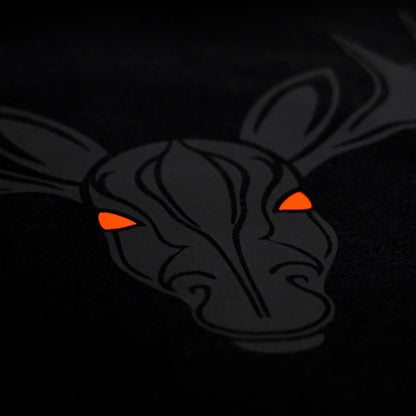 Close-up of the Noir et Noir Moose unisex T-shirt, highlighting the intricate black-on-black moose print. Perfect for those who appreciate subtle yet striking style. Part of the exclusive Design Collection.