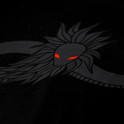 Close-up of the Noir et Noir Feathered Snake unisex T-shirt, highlighting the intricate feathered snake black-on-black print. Perfect for those who appreciate subtle yet sophisticated style. Part of the exclusive Design Collection