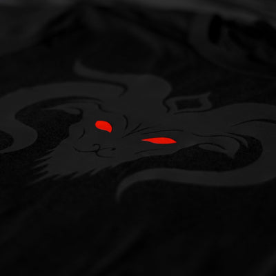 Close-up of the Noir et Noir GOAT unisex T-shirt, highlighting the detailed black-on-black matte print of the GOAT design. Perfect for those who appreciate subtle yet striking style. Part of the exclusive Design Collection